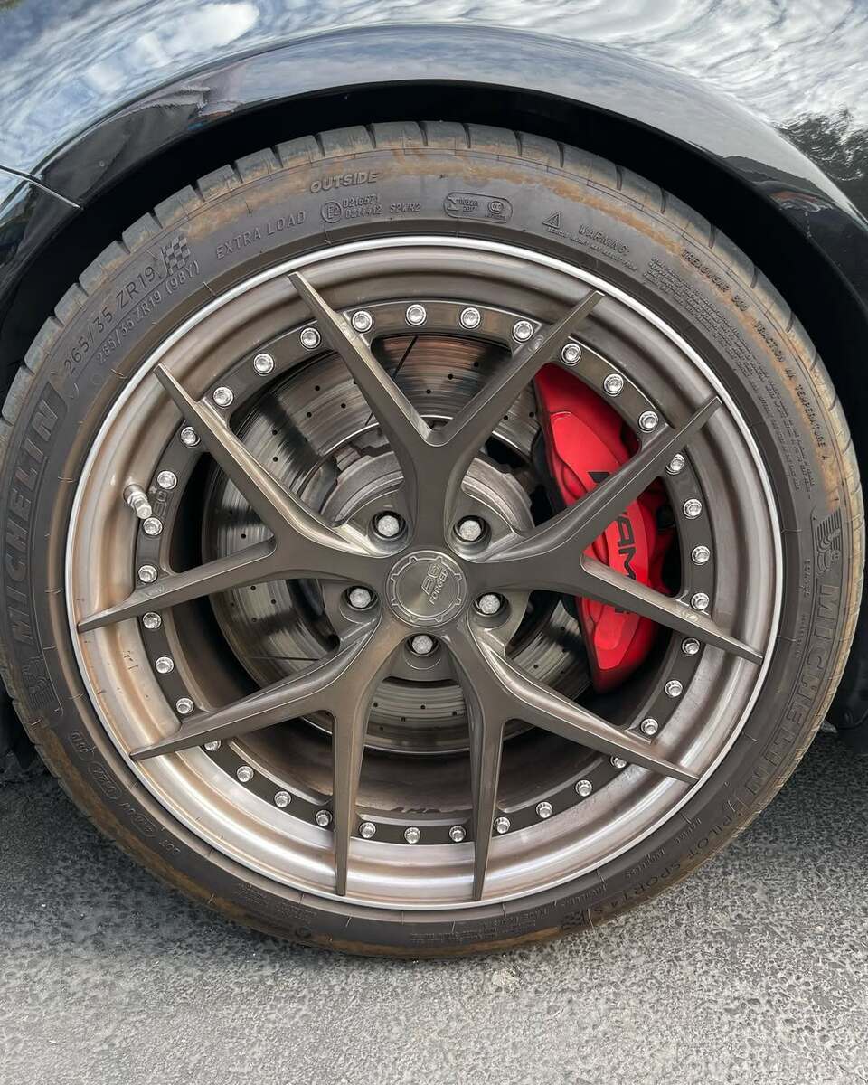 Heavily corroded wheel before professional restoration service