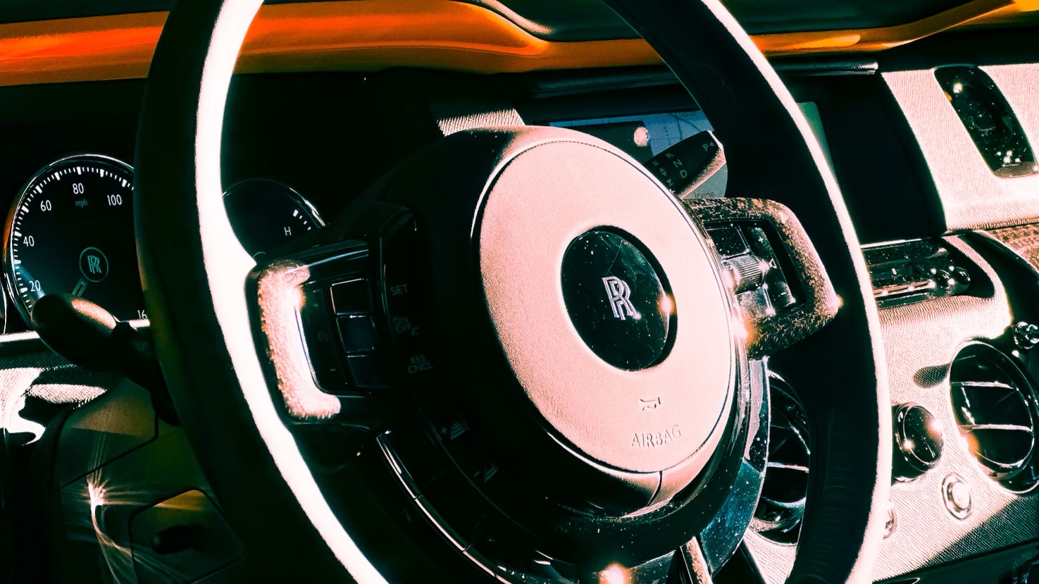 Luxury Rolls-Royce dashboard receiving meticulous detailing